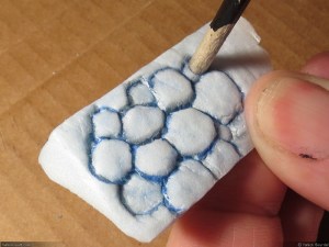 Push some stones inward using the tip of brush or similar tool, just to get the stones more uneven.